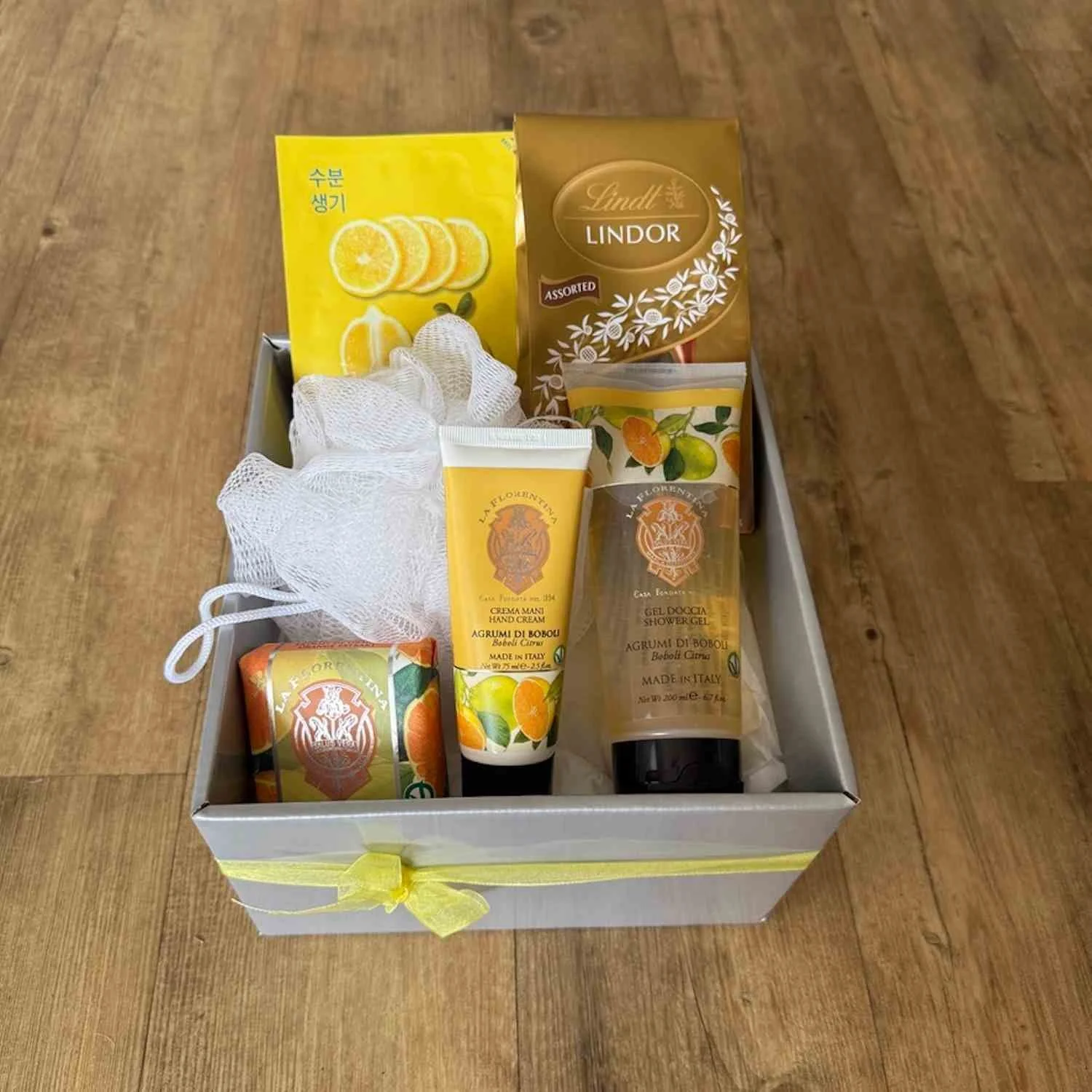 The Serene pamper gift includes Italian pamper products - Shower gel, Hand Cream, soap, a face mask, a washer and chocolates.