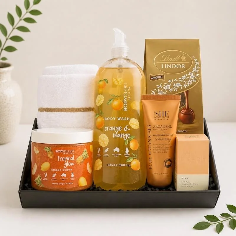 Womans pamper hamper with australian products, body wash, scrub, hand cream, chocolates, face cloth and scented oil.