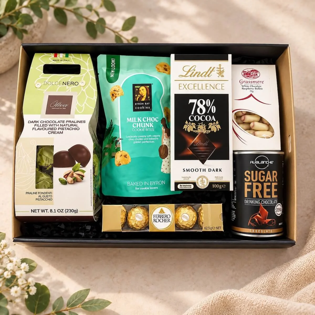 Sweet Tooth Box chocolate hamper with Lindt, Ferrero Rocher, pralines, cookies and chocolates in a black gift box with ribbons and bows same-day delivery Gold-Coast.