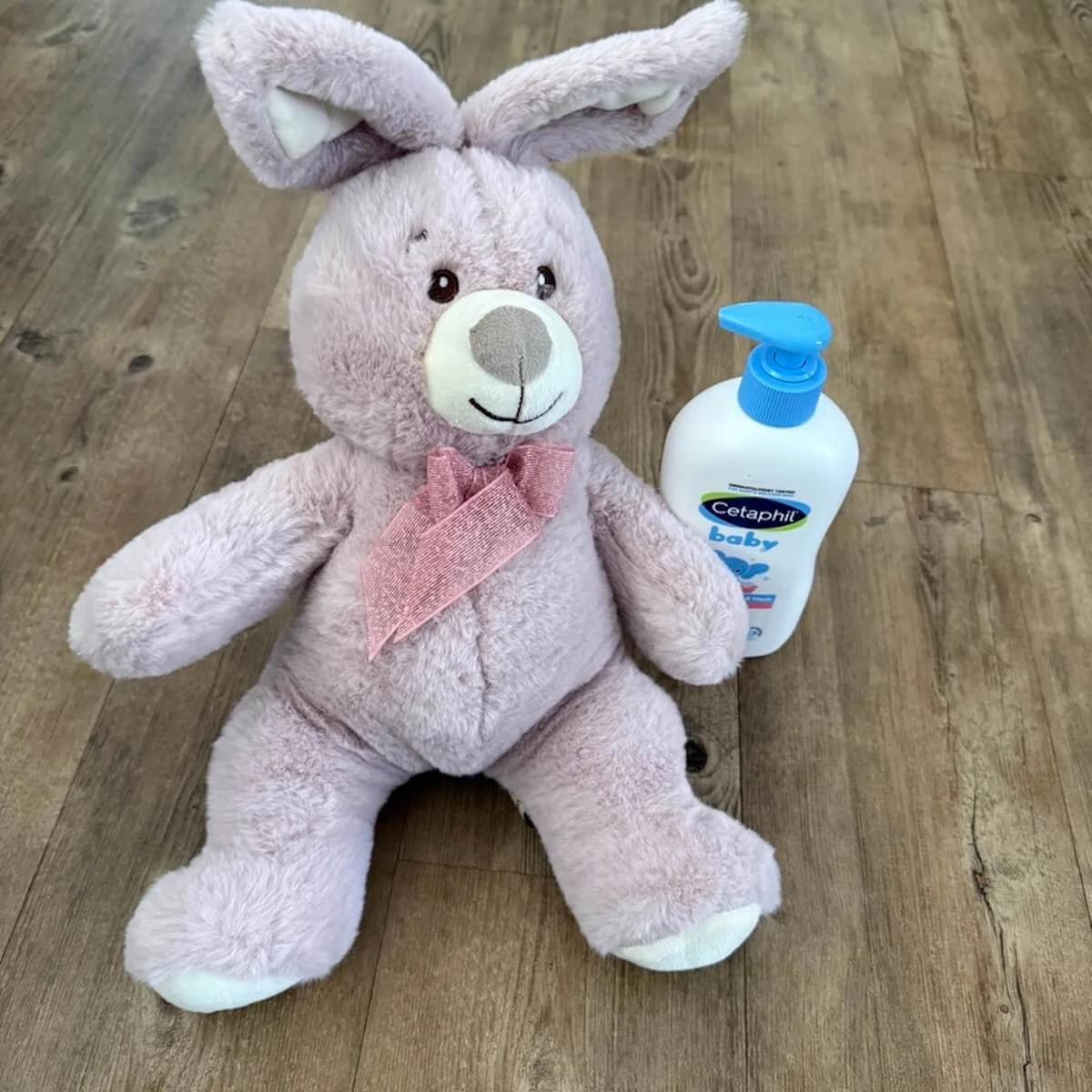Soft pink bunny toy and Cetaphil Baby moisturising bath and wash for delicate skin
