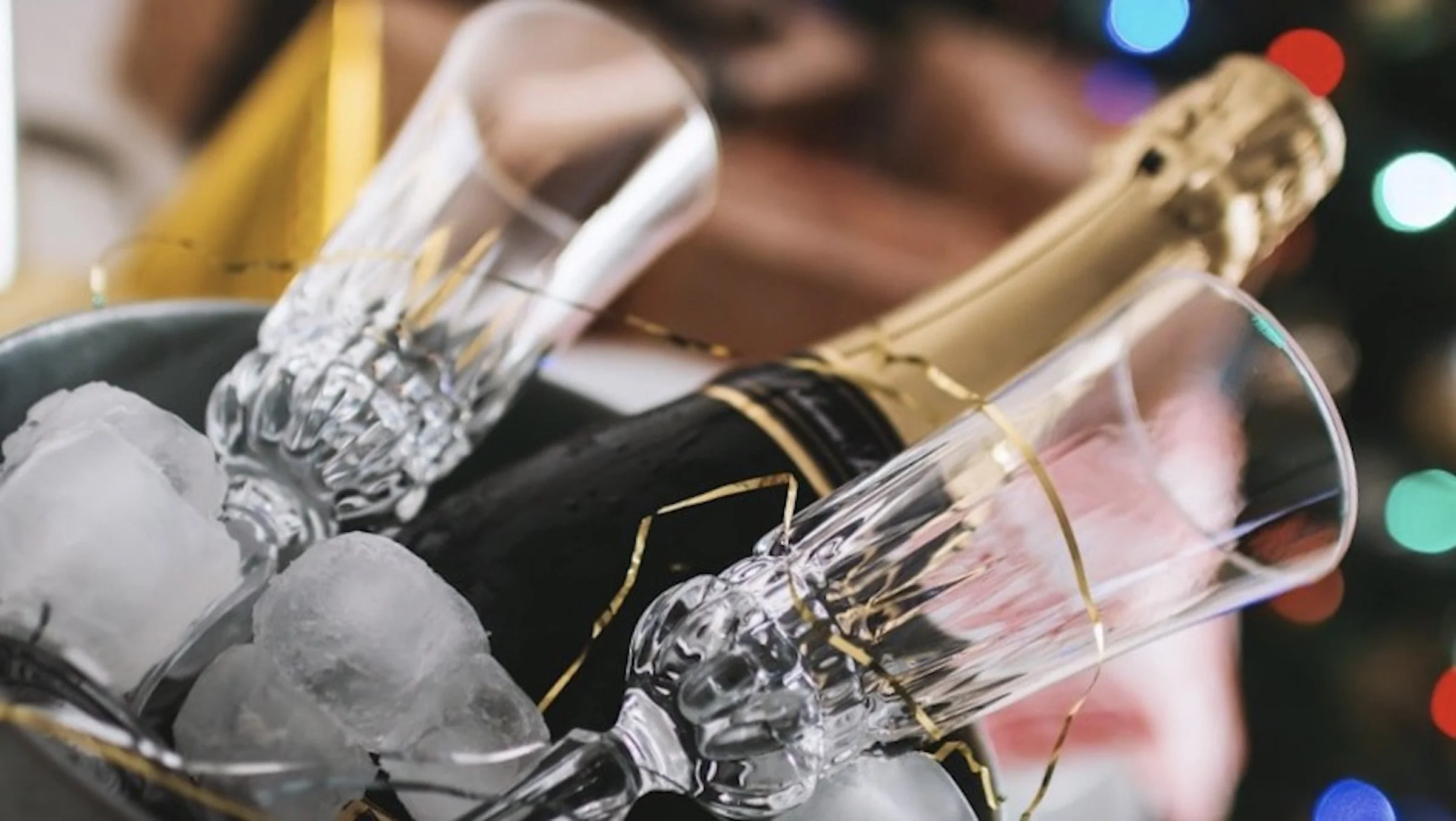 Ice bucket with chilled champagne and glasses, perfect for gifting or special occasions on the Gold Coast