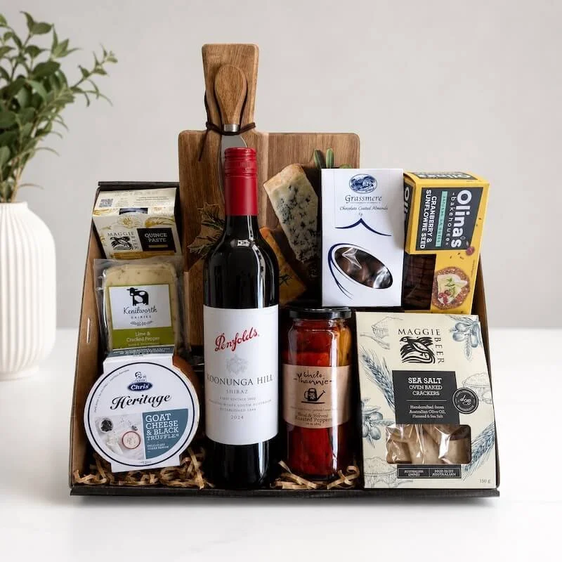 Wine Cheese hamper with a cheese board and knife and a selection of gourmet sweet and savoury items.