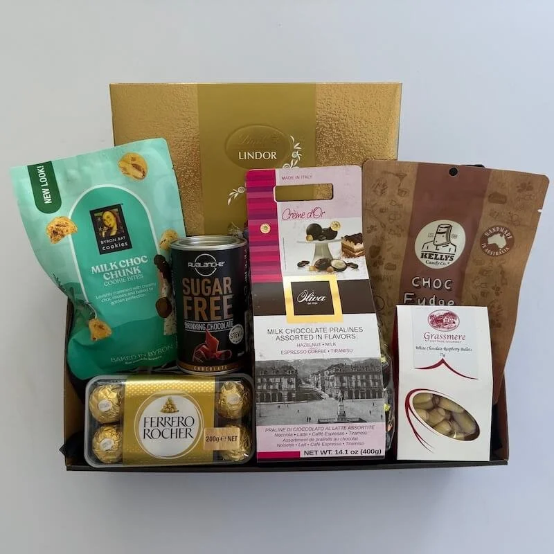 A Chocolate hamper with a assortement of quality chocolate treats. Includes Lindt, Ferrero Rochers, Italian chocolates, kellys fudge, byron bay cookies, chocolate drink and white chocolate raspberry bullets.