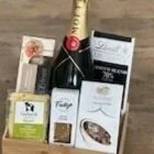 Moët & More corporate celebration gift hamper with chilled Kenilworth Cheese, Lindt chocolate, and caramel fudge.