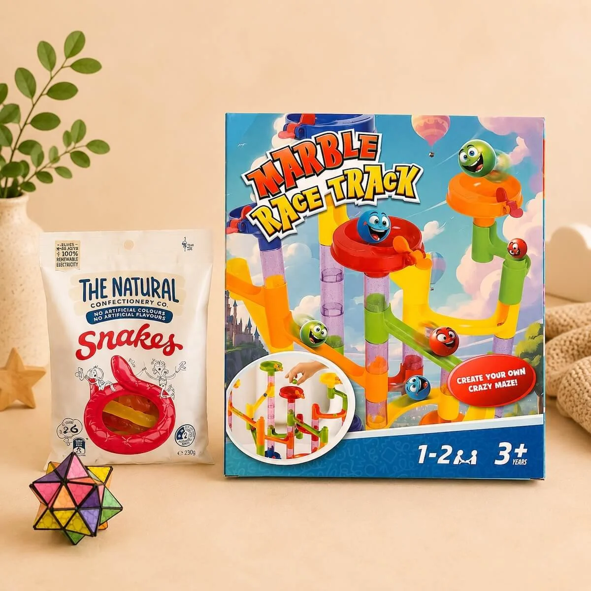 Marble race track game andMini hand puzzle and snake lollies included in the Little Boy Blue Gift Hamper