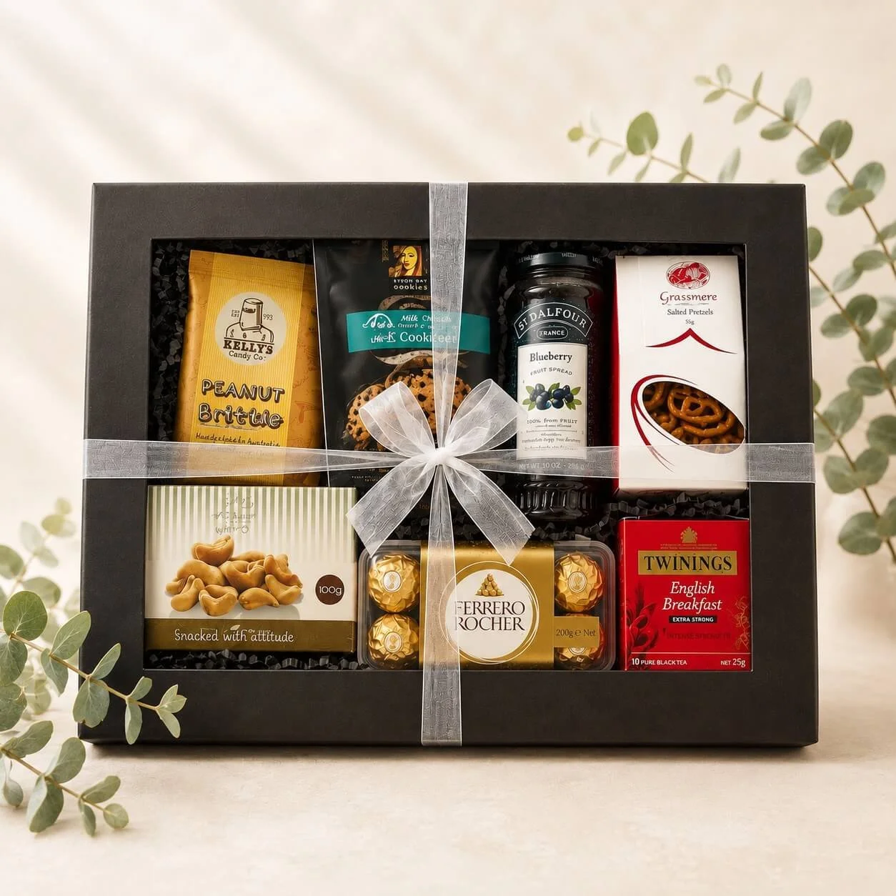 Ferrero Rocher gourmet gift box with lid on, tied with elegant ribbons in a black window gift box gold coast delivery.