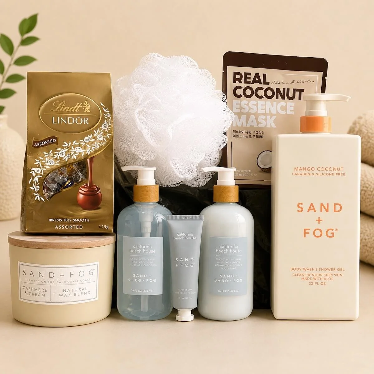 Gift hamper with Sand and fog hand Treatments and Body Wash and Candle. Also includes a face mask, body washer and chocolates.