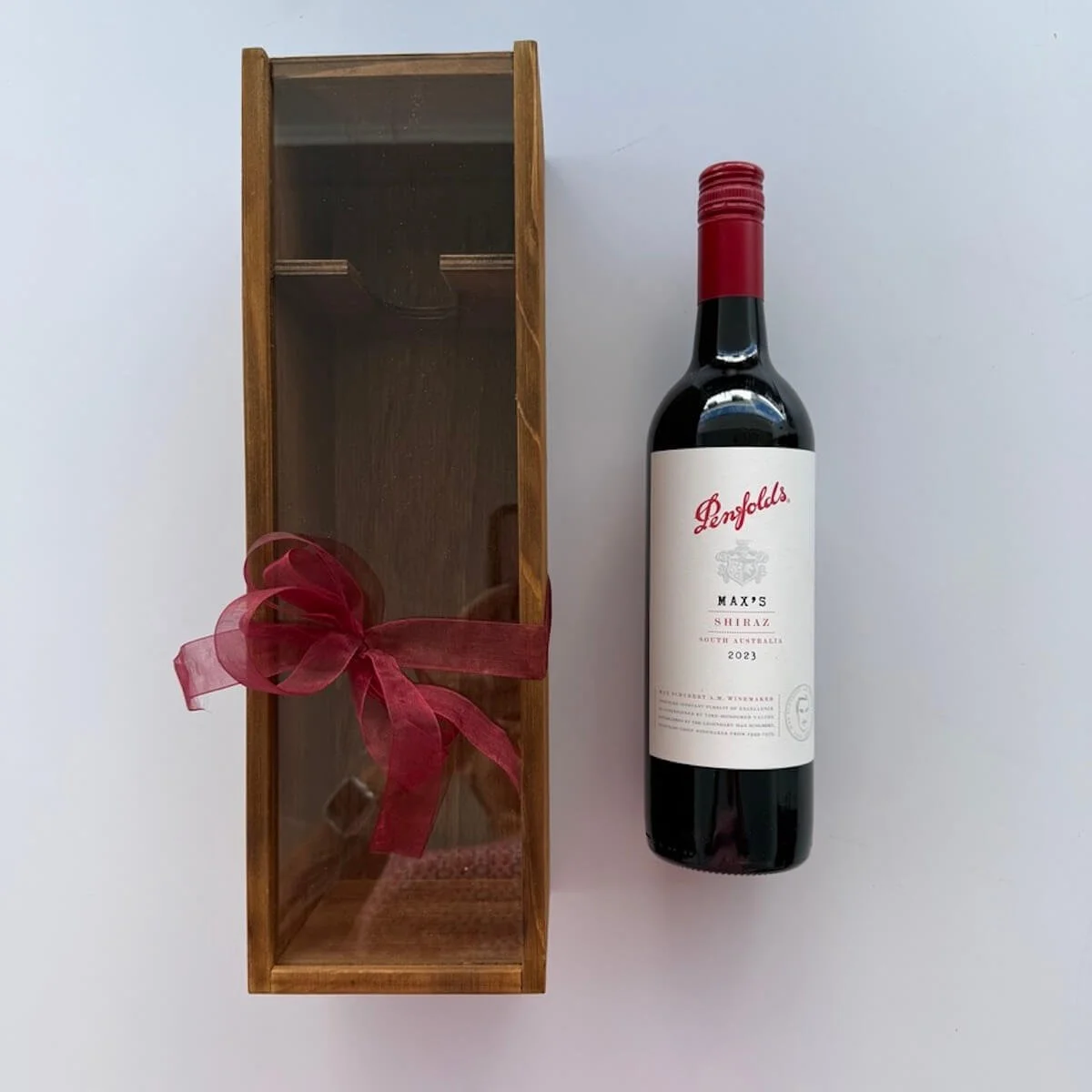Max's Shiraz Wine gift. A 750 ml bottle of Max's Shiraz in a wooden wine gift box decorated with ribbons and bow delivery Gold Coast..