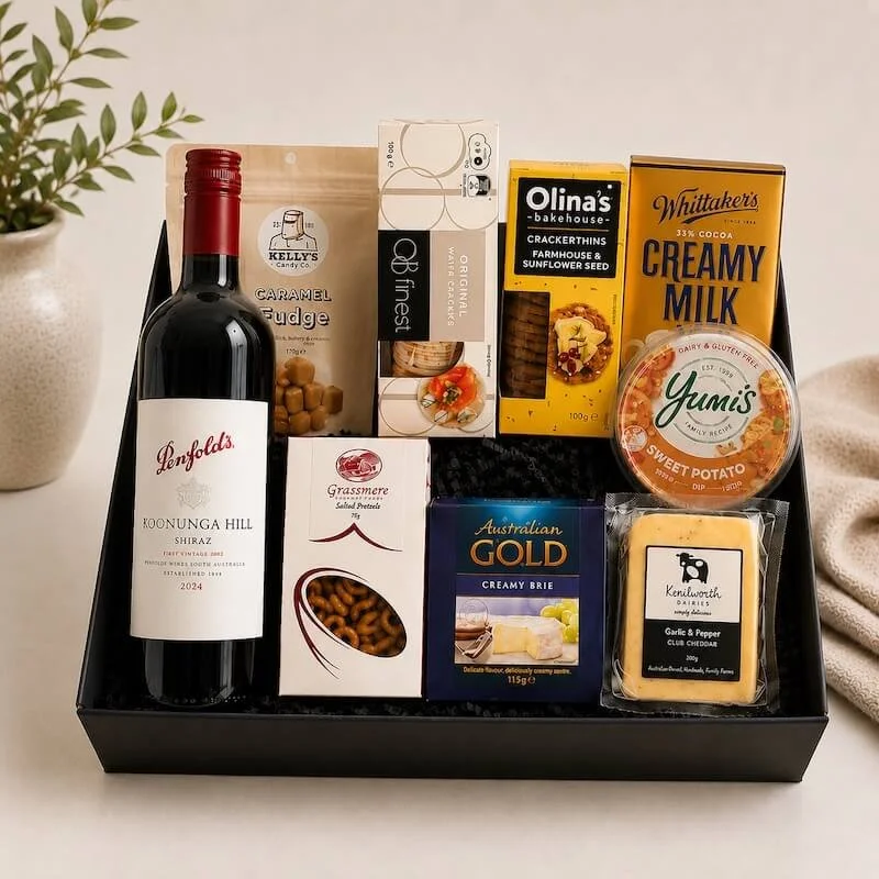Gift hamper with 700ml bottle of wine 2 pack of crackers, 2 cheeses and a dip, block of chocolate, packet of fudge and gourmet pretzels.