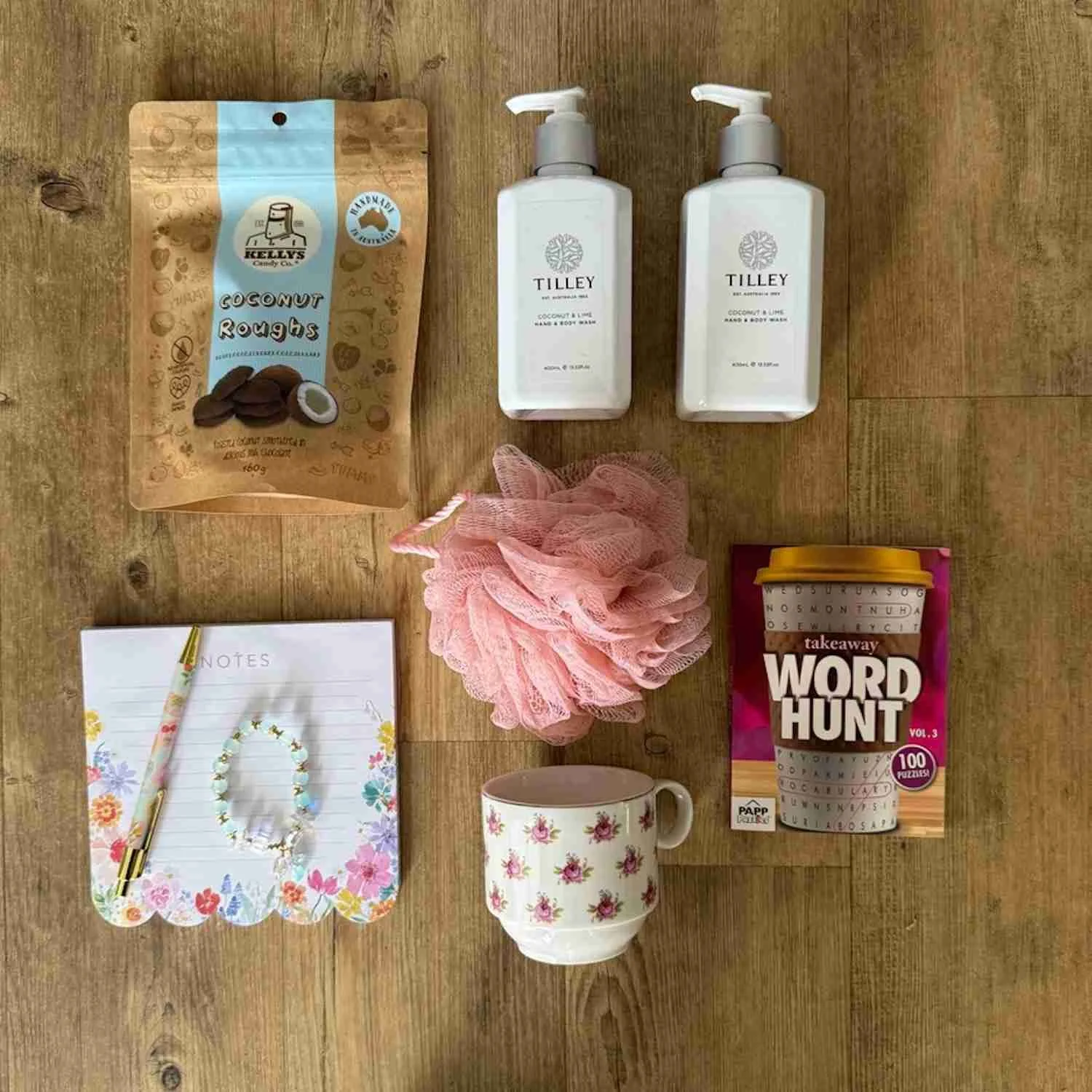 Ladies Gift Contains Tilley Body lotion & Wash, mesh washer, a note pad, pen, word hunt book, cup, bracelet & Chocolates.