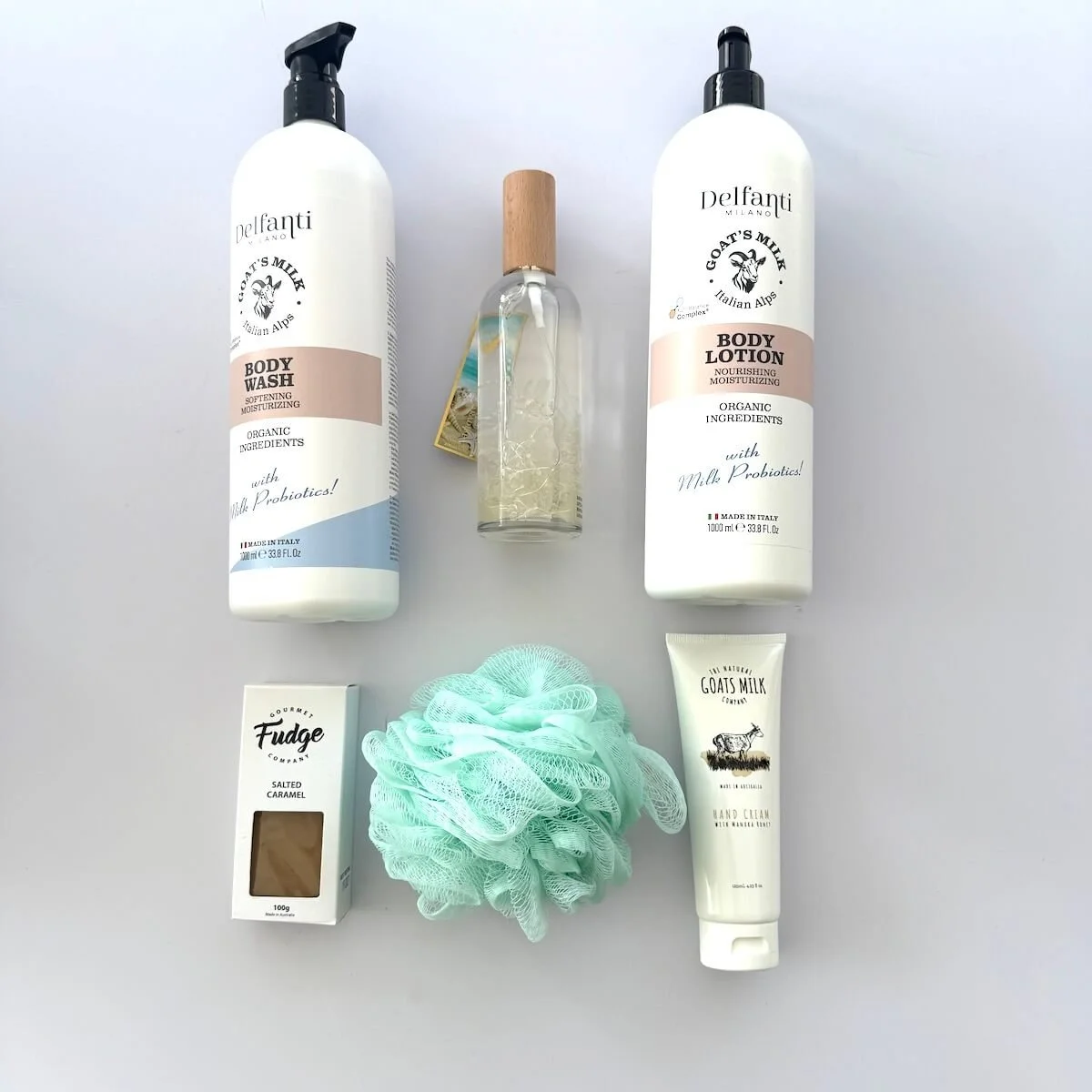 Amber Luxury Gift Box: 1000ml Italian Goats Milk wash & lotion, Australian hand cream, botanical room spray with dried flowers, mesh sponge, and gourmet fudge.