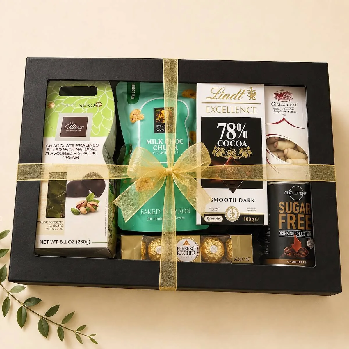 Premium chocolate gift box filled with Lindt, Ferrero Rocher, pralines, cookies and sugar-free drinking chocolate, finished with ribbons and bows for delivery Gold Coast.