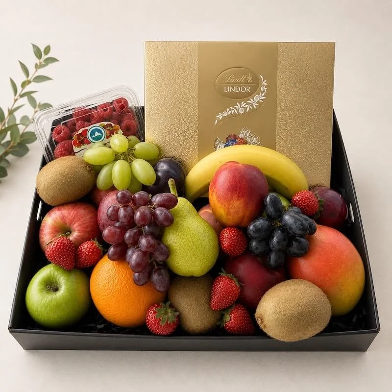 Fruit hamper and chocolate gift, includes a selection of mixed seasonal fruit and a box of lindt assorted chocolates.