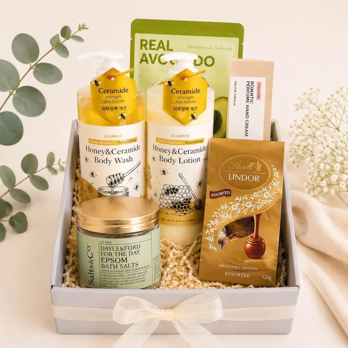 Pamper gift box with body wash and lotion, epsom salts, hand cream and face mask with chocolates for Gold Coast Delivery.