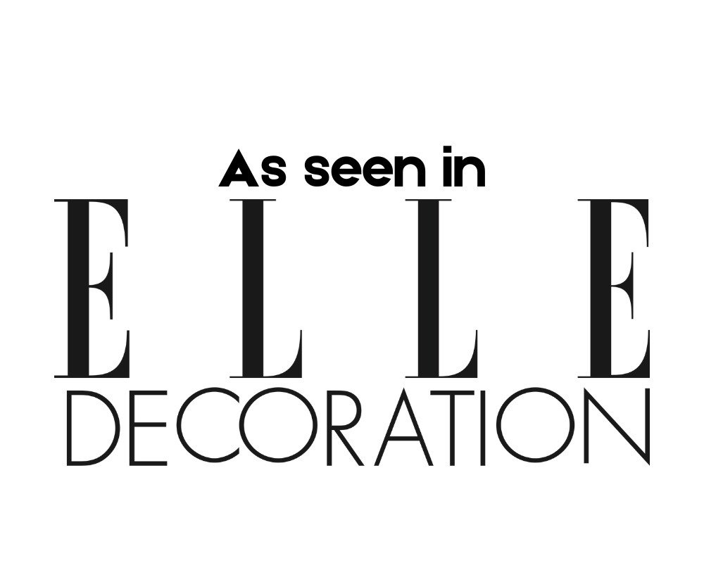 Text graphic reading 'As seen in ELLE DECORATION' in black font on a white background.