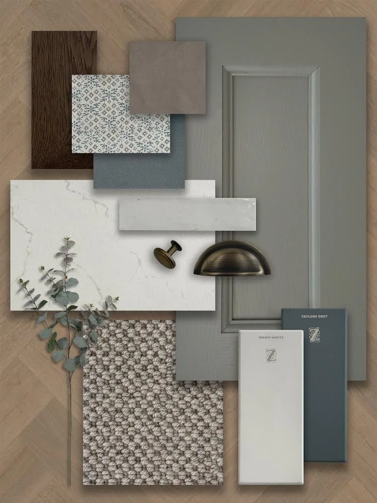 Sample of interior design materials including paint swatches, fabric samples, wood veneer, a decorative branch, a metal door handle, and granite slab.