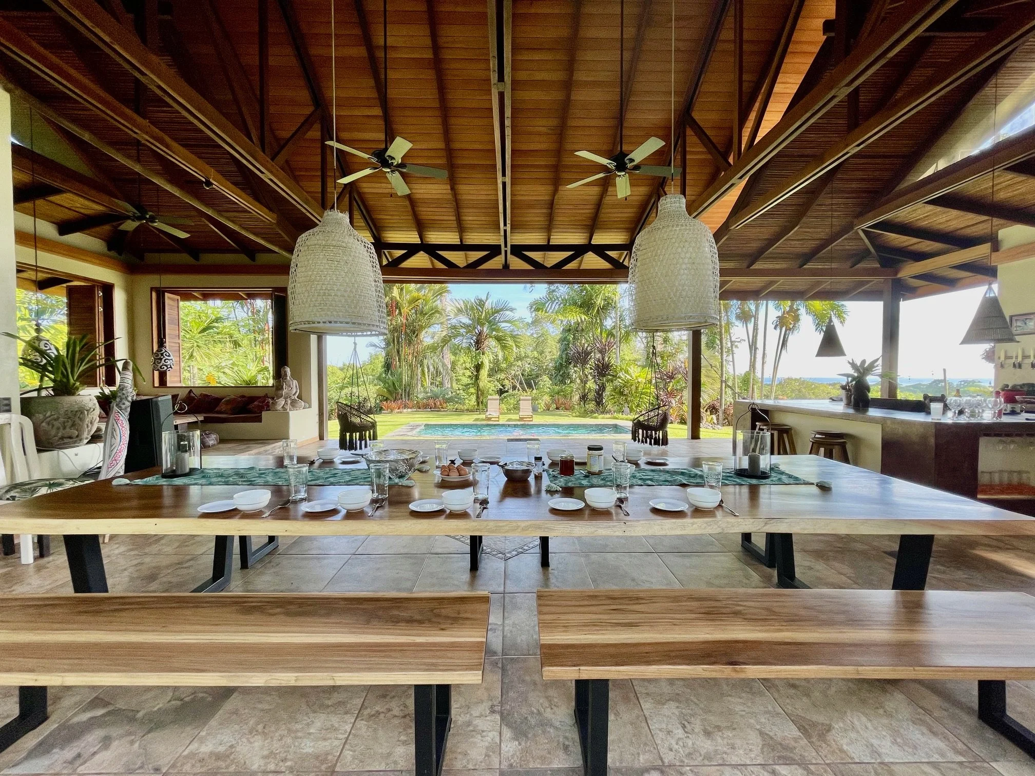 Communal dining overlooking the swimming pool 
