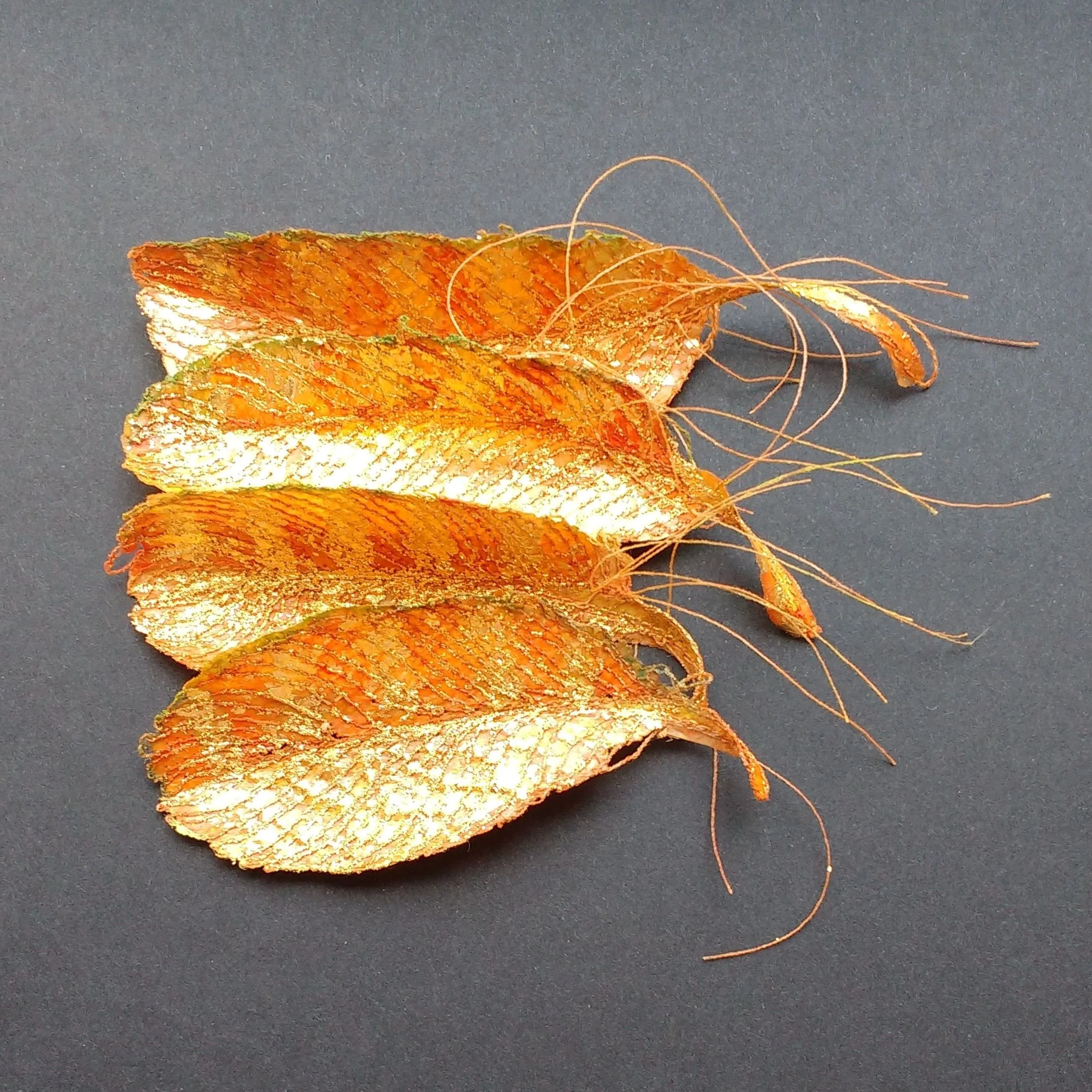 Carole Bury. Golden Feathers: Security. Paper Textile, machine embroidery, pigments and gold leaf.  contact BobCat Gallery, Putney Exchange