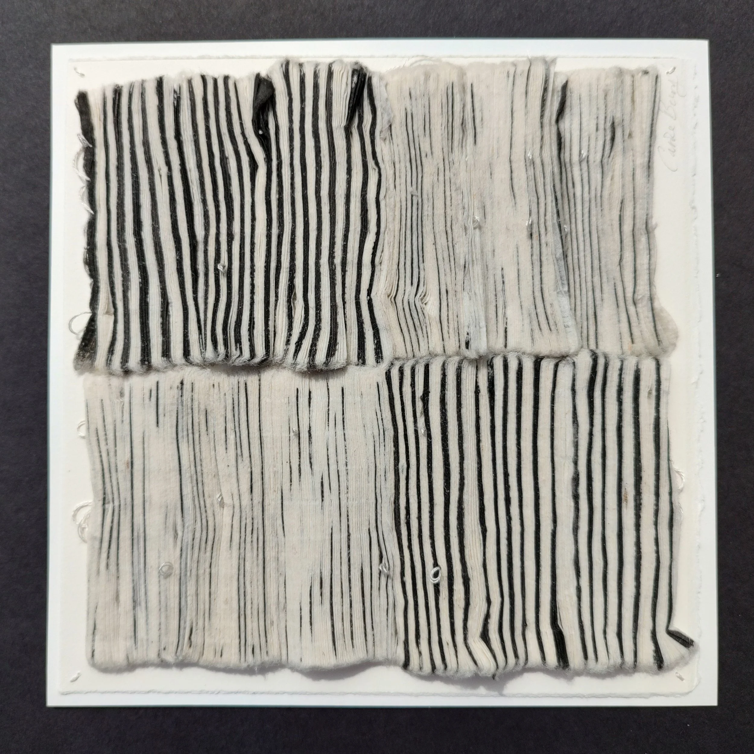 CaroleBury. Threaded Landscape. 
BobCat Gallery 100 x 100
Pleated mulberry tissue, sumi ink, silk threads. 23x23cm £100.00