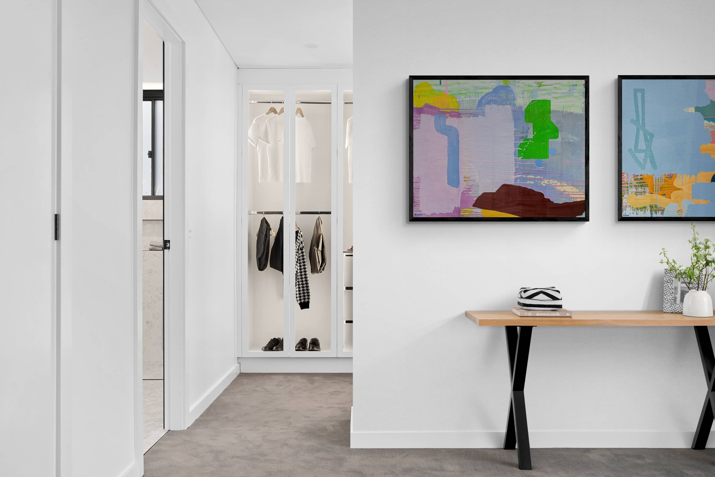 Colourful abstract oil paintings in minimal white walk in wardrobe, lavender green and brown canvas by Irish artist Martin Finnin, statement art for modern interior