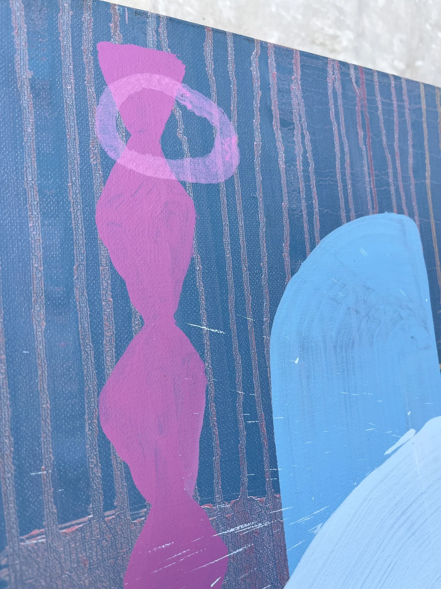 Close up detail of canvas corner, magenta pink totem form and pale blue shape on deep dark blue ground with fine line texture, Martin Finnin West Cork studio