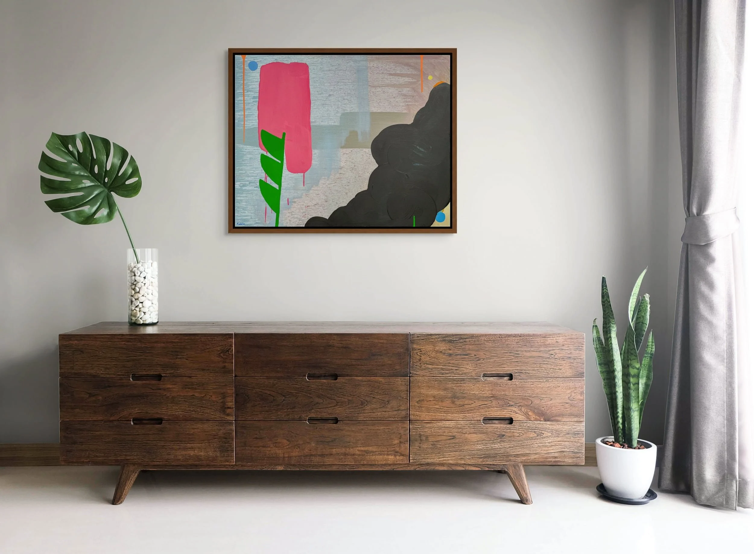 Colourful abstract oil painting above dark walnut mid-century sideboard with monstera and snake plant, pink green and black contemporary canvas, statement art for natural material interior, Martin Finnin Irish artist