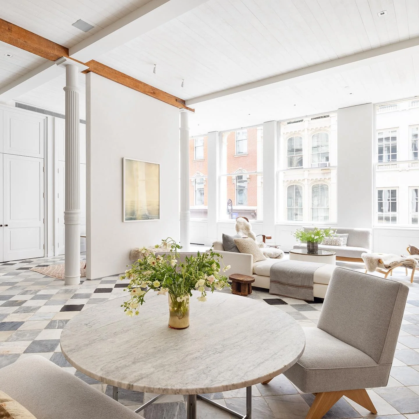 Just Listed // Located in the heart of Soho, this spectacular turn-key home offers the best of loft living and features soaring 14-feet high ceilings, enormous custom-made double-hung thermal windows, Marmorino plaster walls, central A/C, and spectac