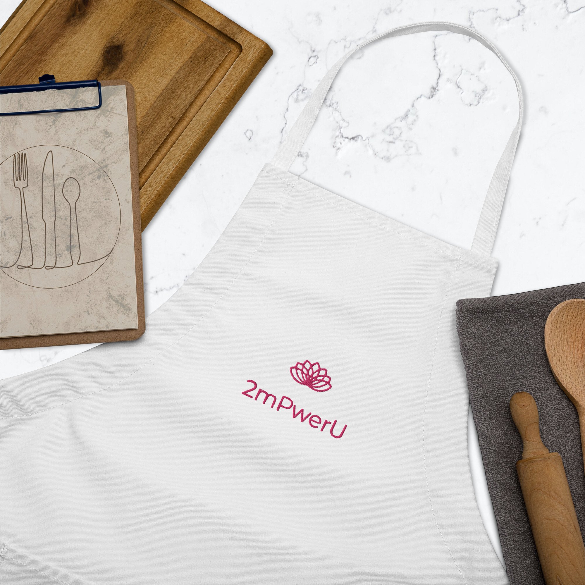 embroidered-apron-white-zoomed-in-63a217f9b88b2.jpg