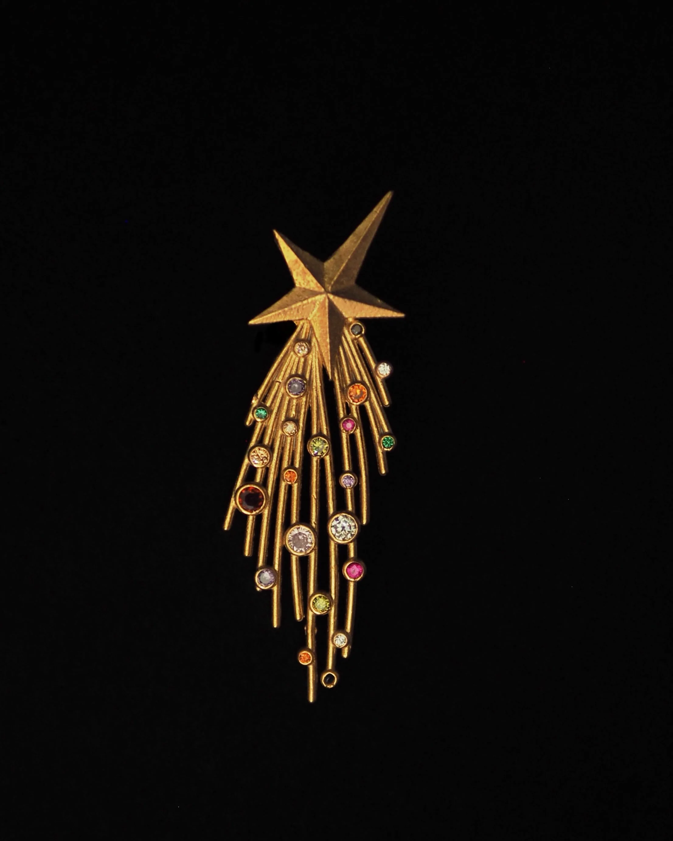 The Golden Comet is crafted in brass and finished with delicate touches of colorful zirconias that catch the light . NOW ON SALE ✨✨✨