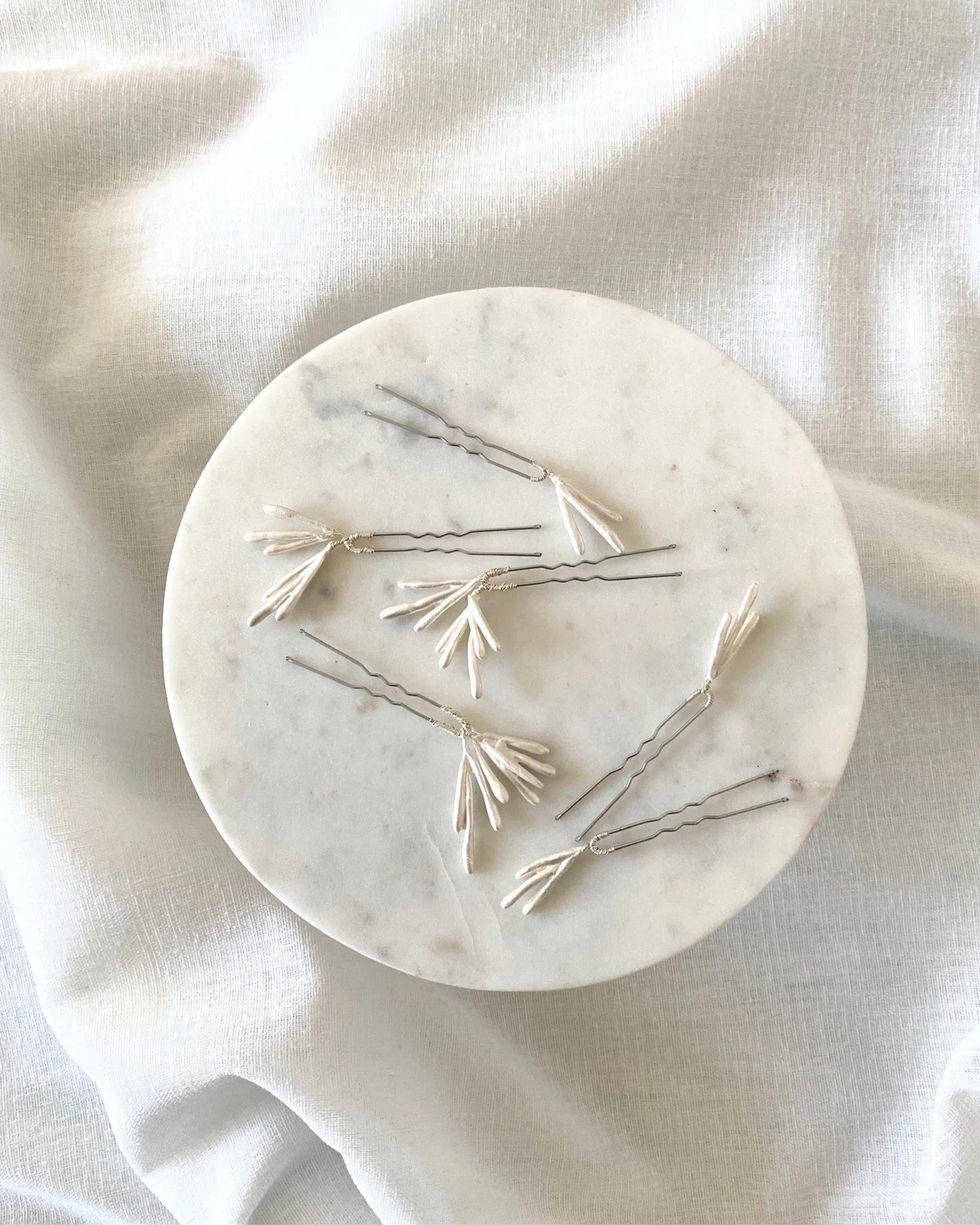 The Makena hair pins echo the natural beauty of corals without harming a single one.