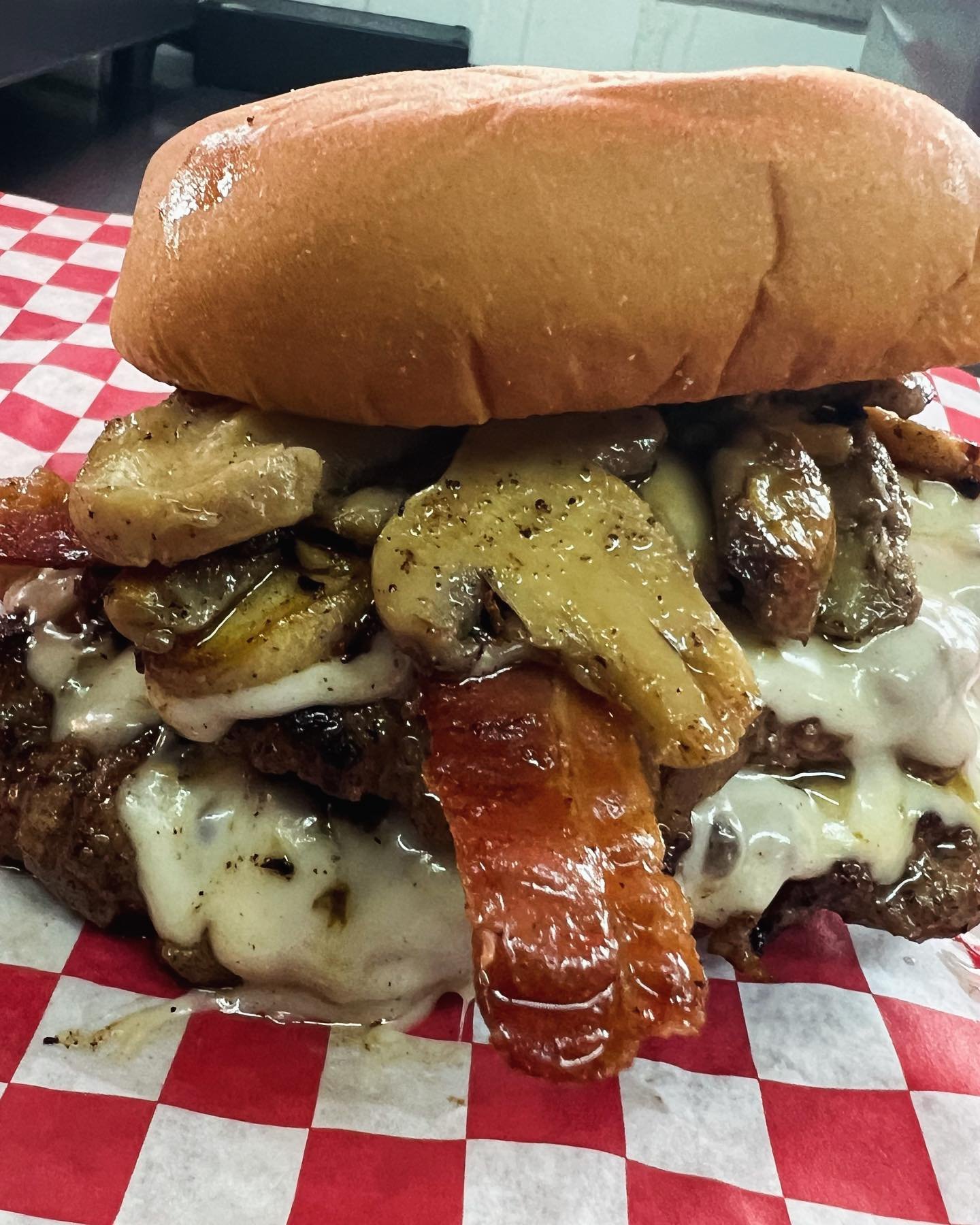 Shroom Boom - grilled onion smash burger, pepper jack cheese, bacon, grilled mushrooms, and our house made boom boom sauce 🍄❤️