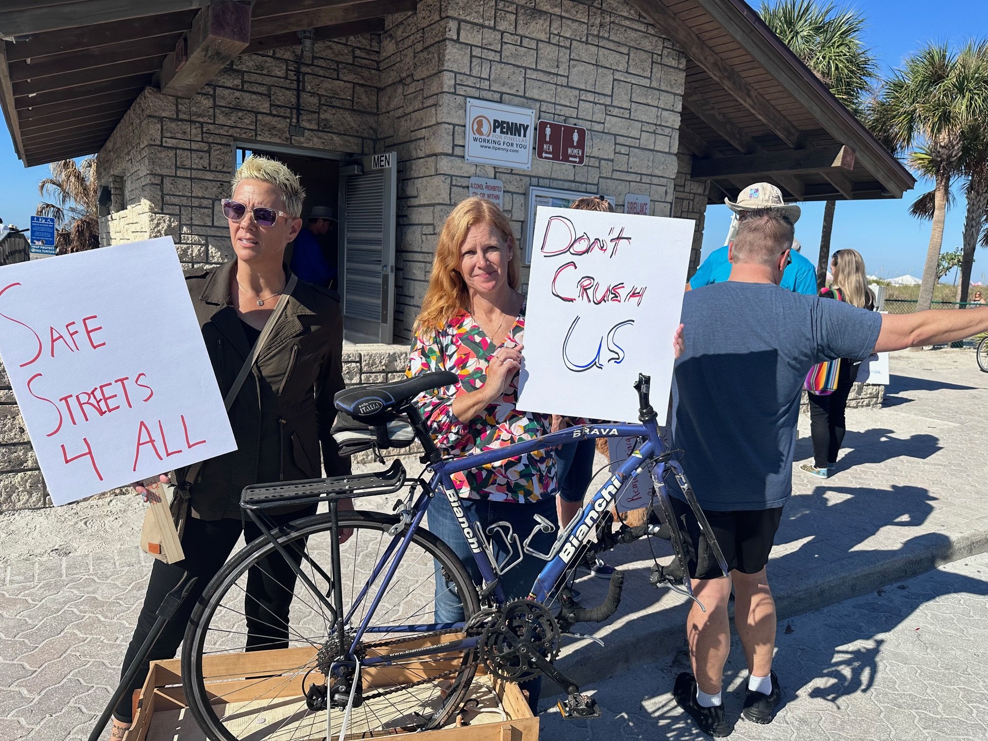  Florida Bicycle Association Executive Director Kelly Morphy, left, and survivor and event organizer Julie Henning, right, demand action for safer streets throughout Florida. 
