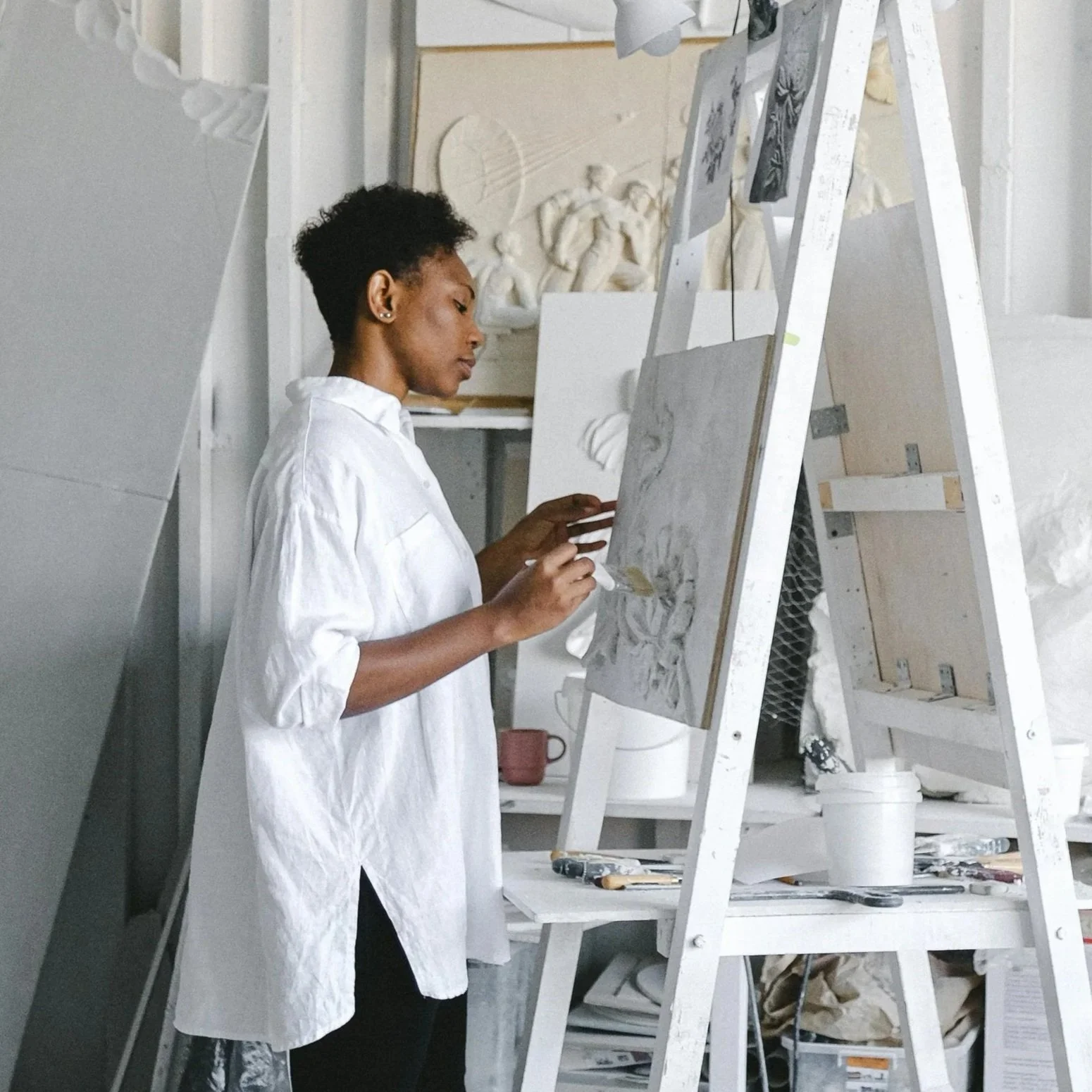 Artist standing at an easel