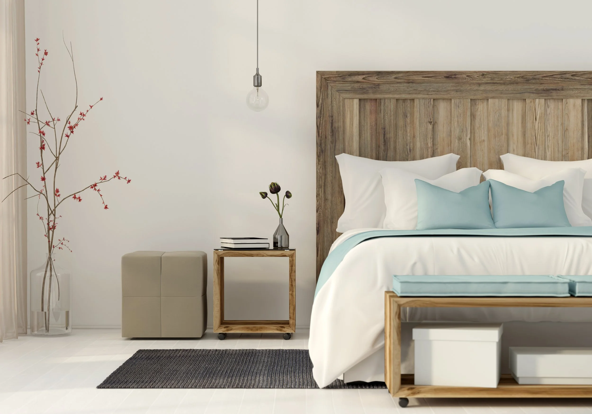 Beautiful bedroom with wooden headboard and white and blue bedding set 
