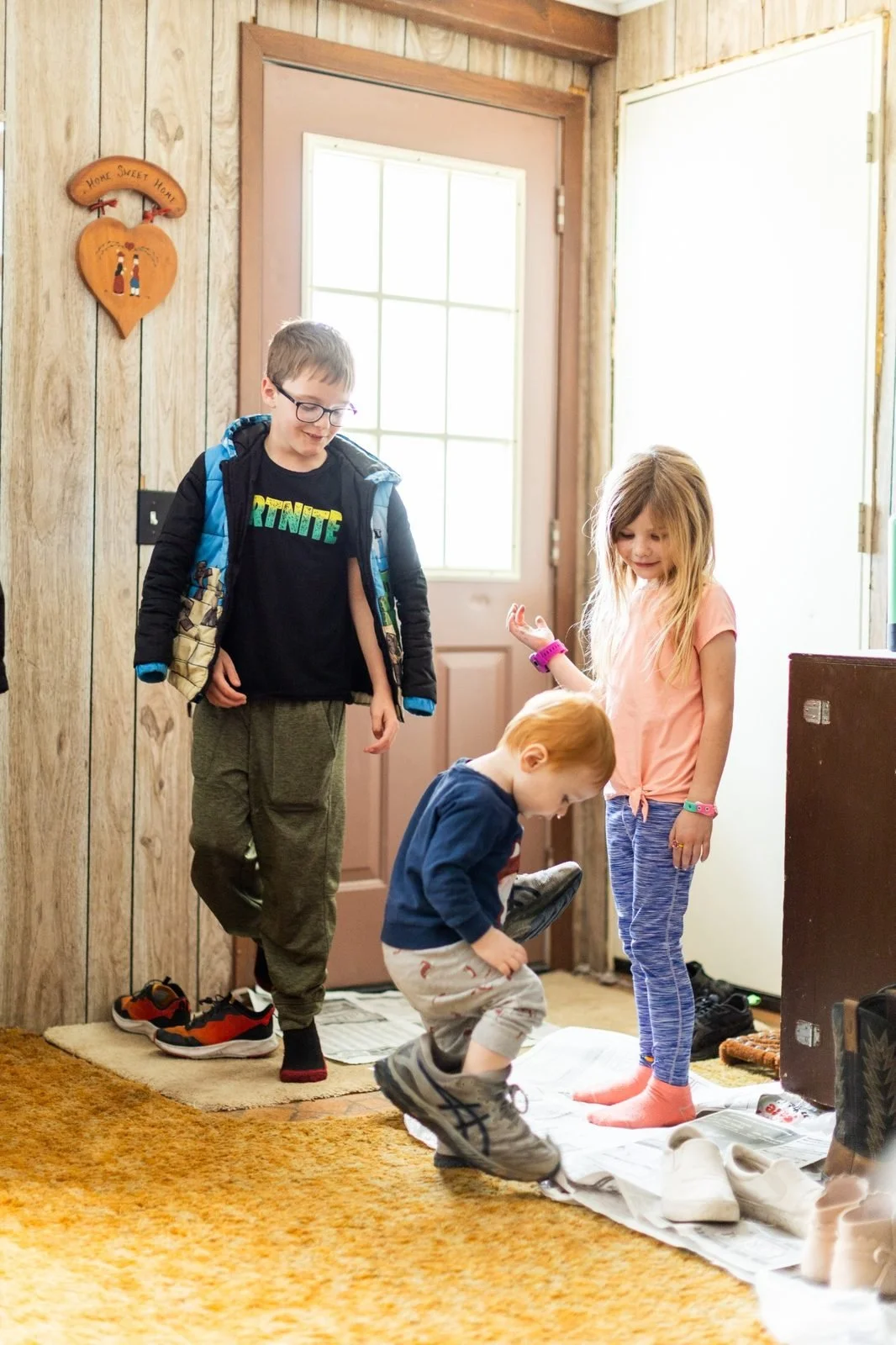 rural-missouri-family-dinner-children-trying-on-shoes.jpg