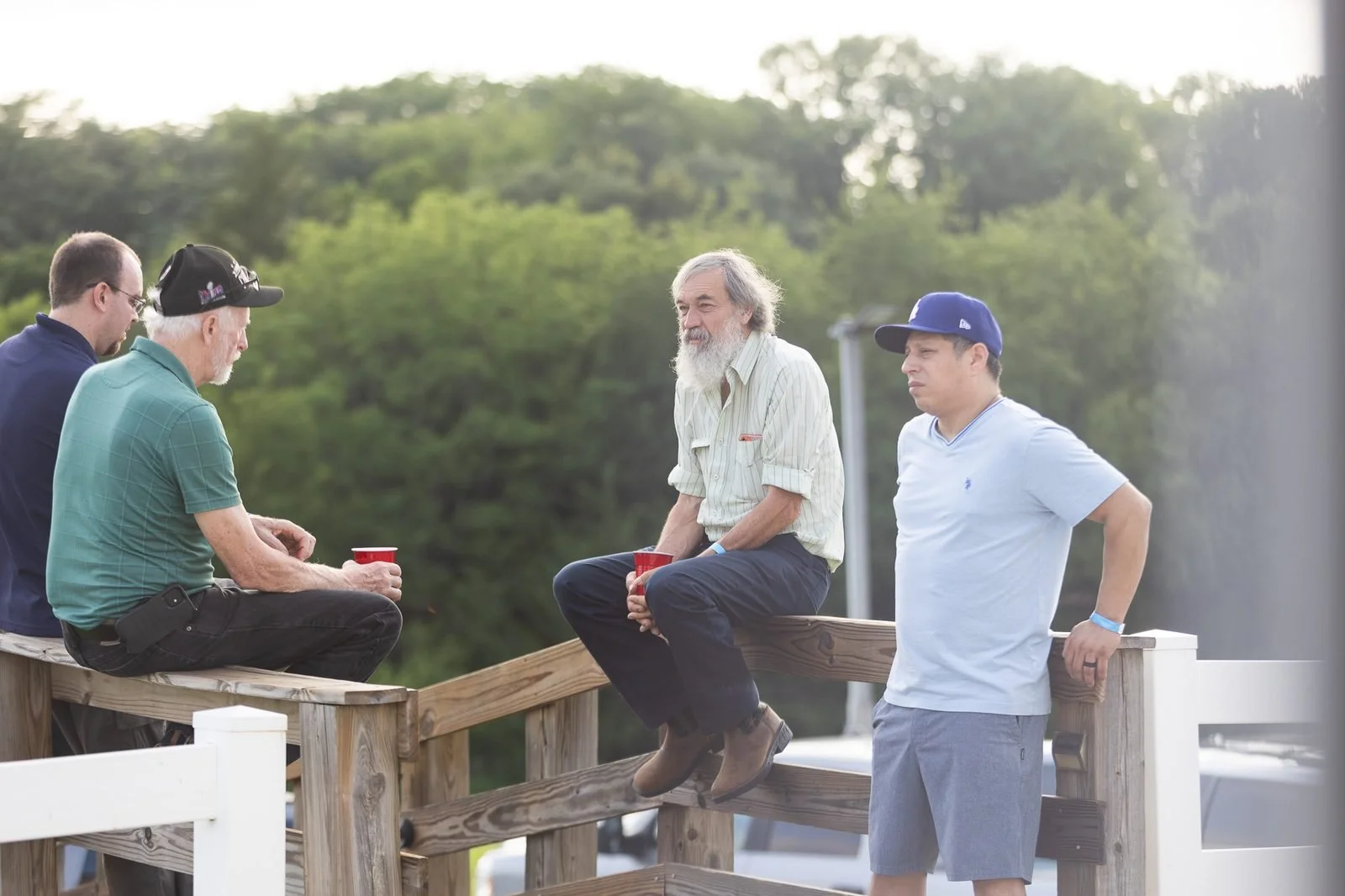 smail-family-reunion-2026-men-talking-on-deck.jpg