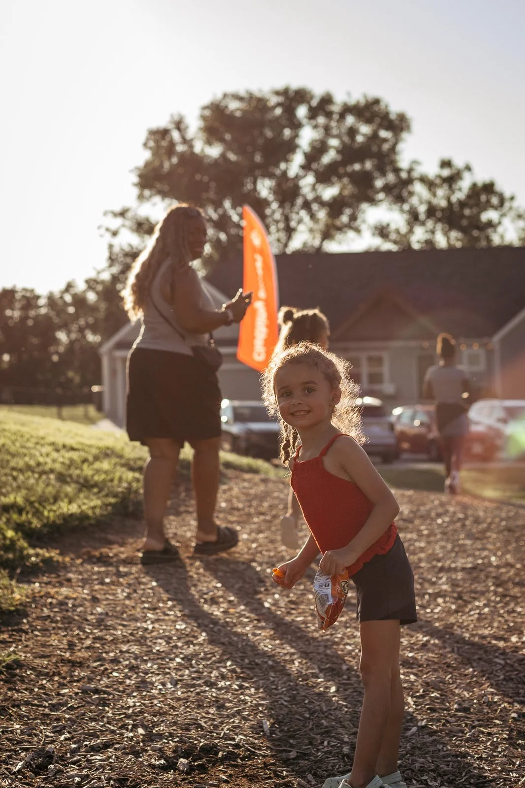 joy-meadows-second-saturday-july-2026-girl-with-snack-at-sunset.jpg