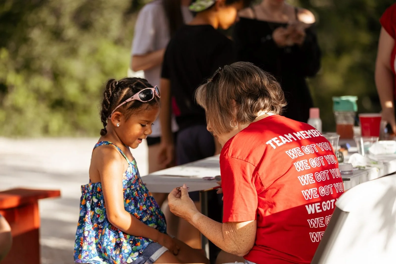 joy-meadows-second-saturday-june-2026-volunteer-face-painting-child.jpg