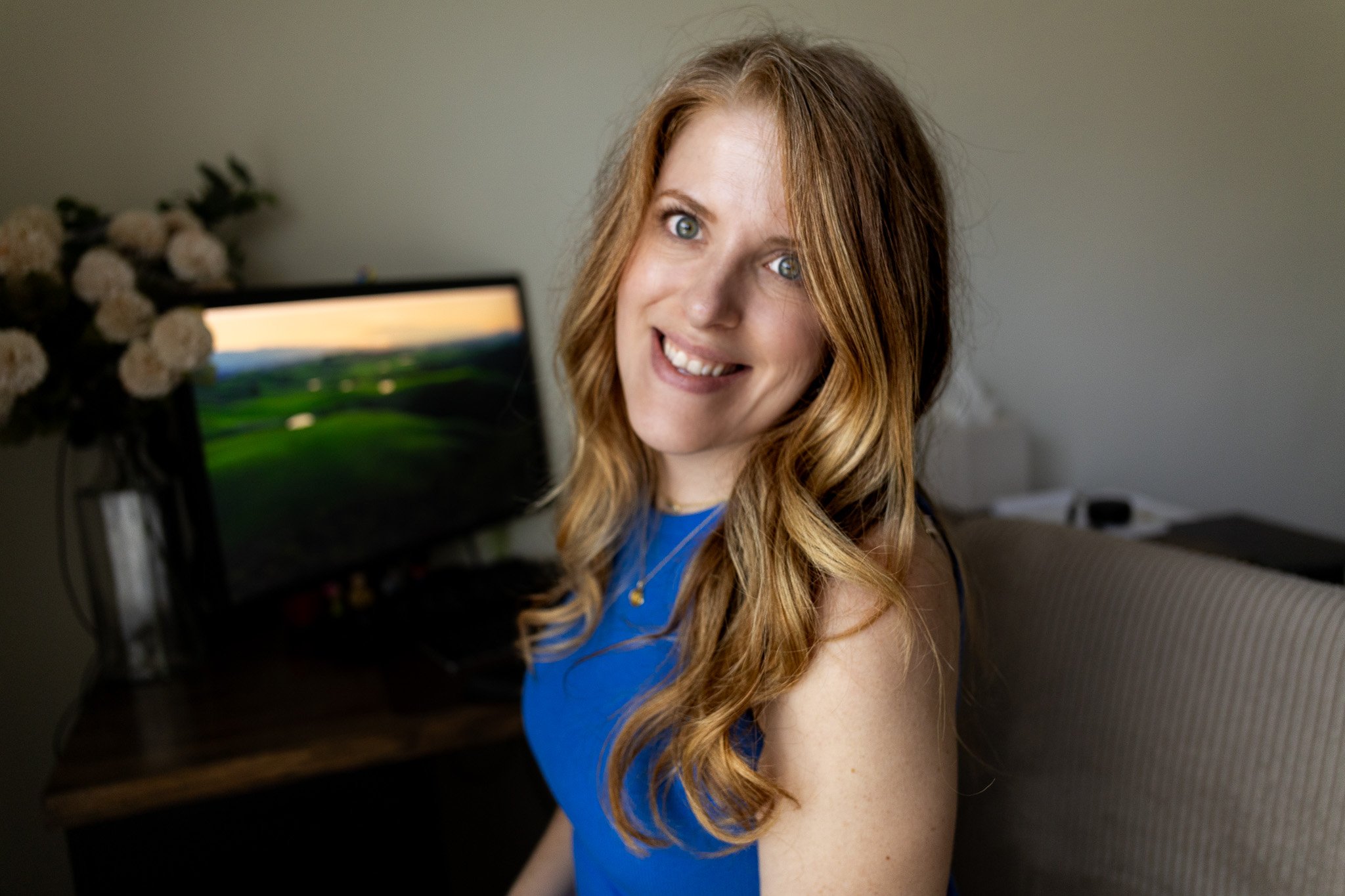 Kelly Thomas, Kansas City graphic designer and strategist, sitting in her office next to her computer.