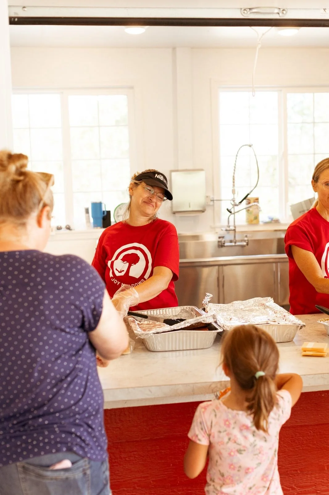 joy-meadows-second-saturday-june-2026-volunteers-serving-meal.jpg
