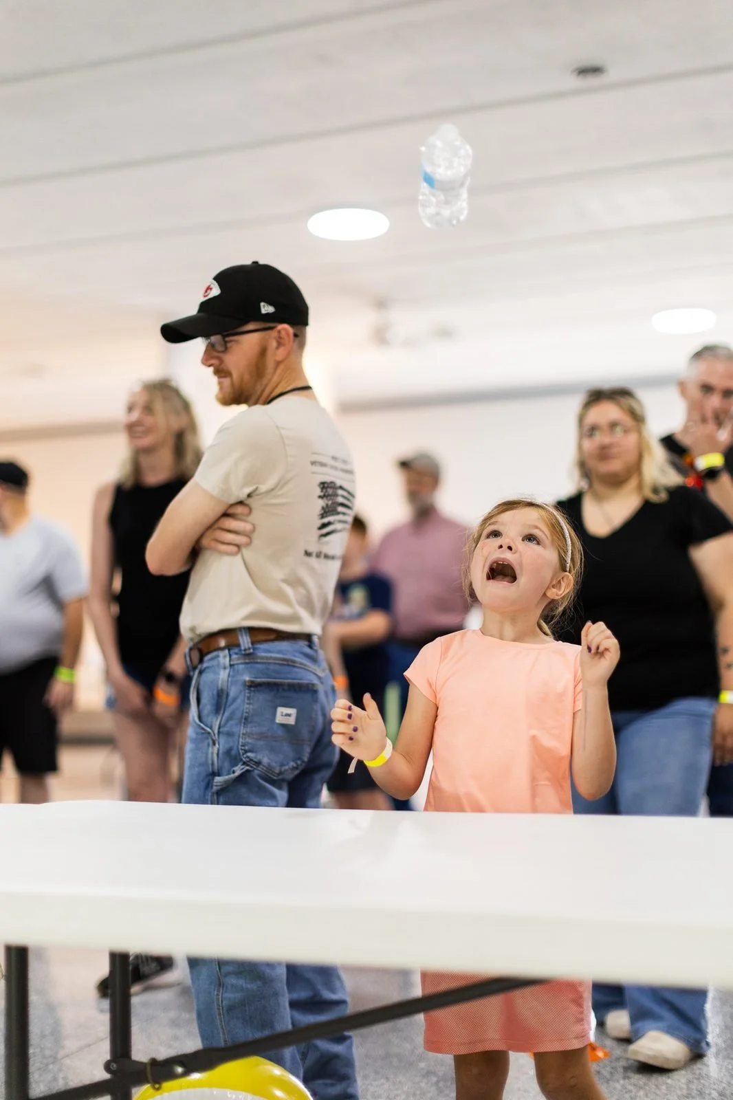 smail-family-reunion-2026-girl-watching-bottle-flip.jpg