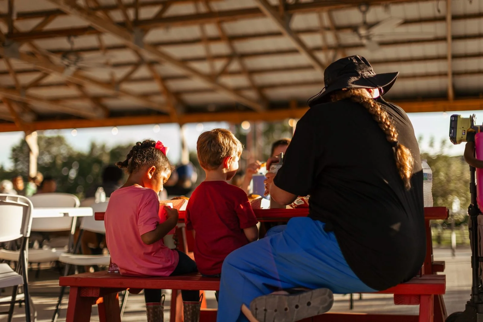 joy-meadows-second-saturday-july-2026-family-at-picnic-table.jpg