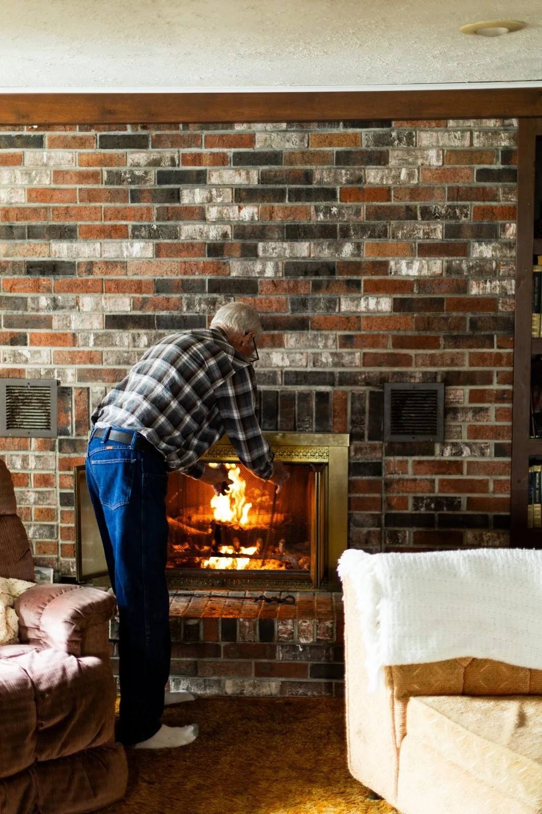 rural-missouri-family-dinner-tending-brick-fireplace.jpg