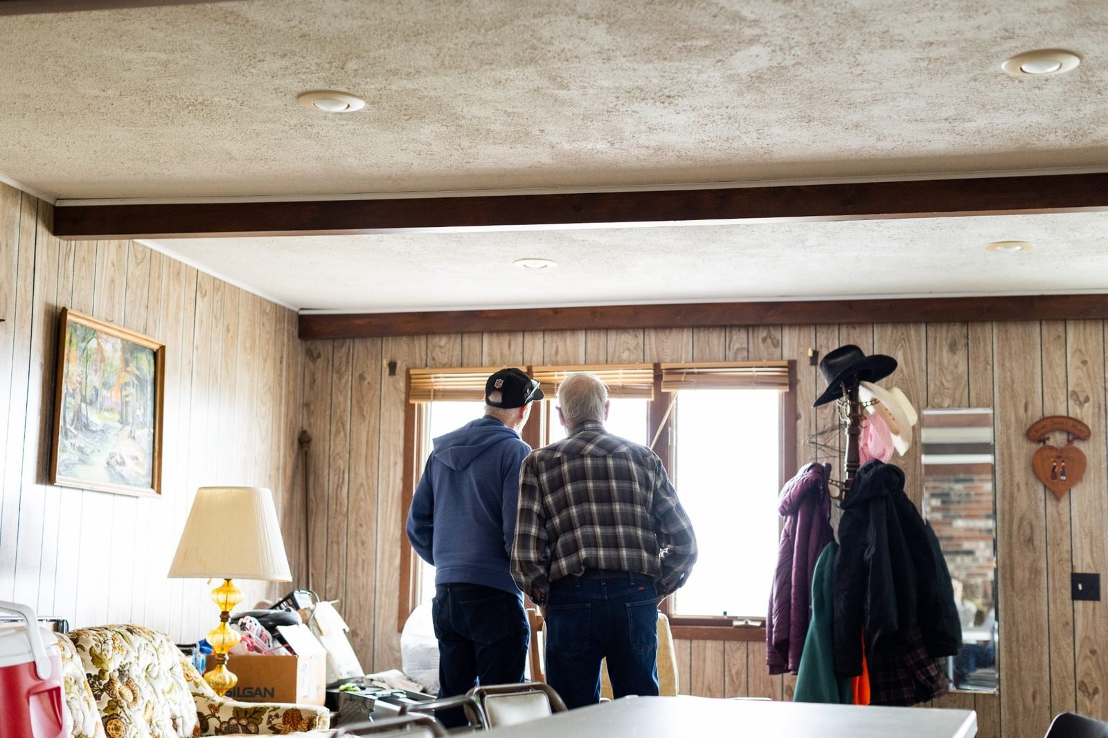 rural-missouri-family-dinner-men-looking-out-window.jpg