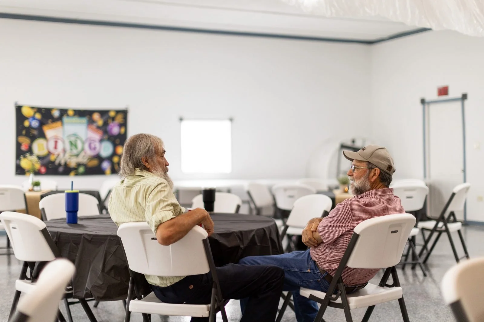 smail-family-reunion-2026-men-talking-at-table.jpg
