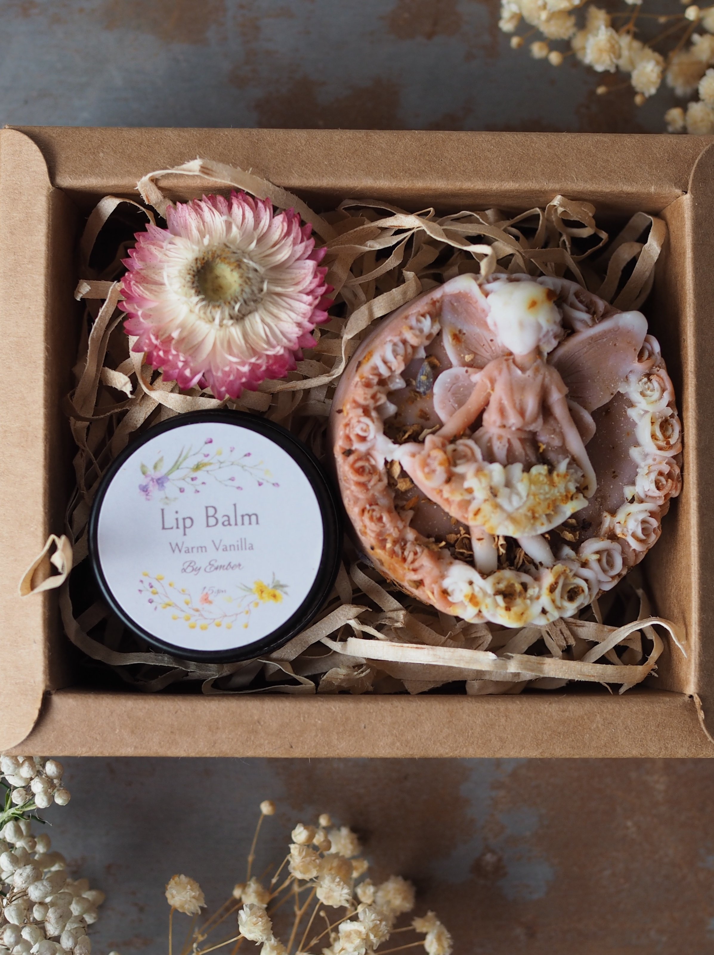 The Fairy Kiss Gift Set A charming duo, beautifully boxed in kraft: • Panna Fairy Soap – whimsical and delicately scented • Ember Lip Balm in Warm Vanilla – rich and nourishing