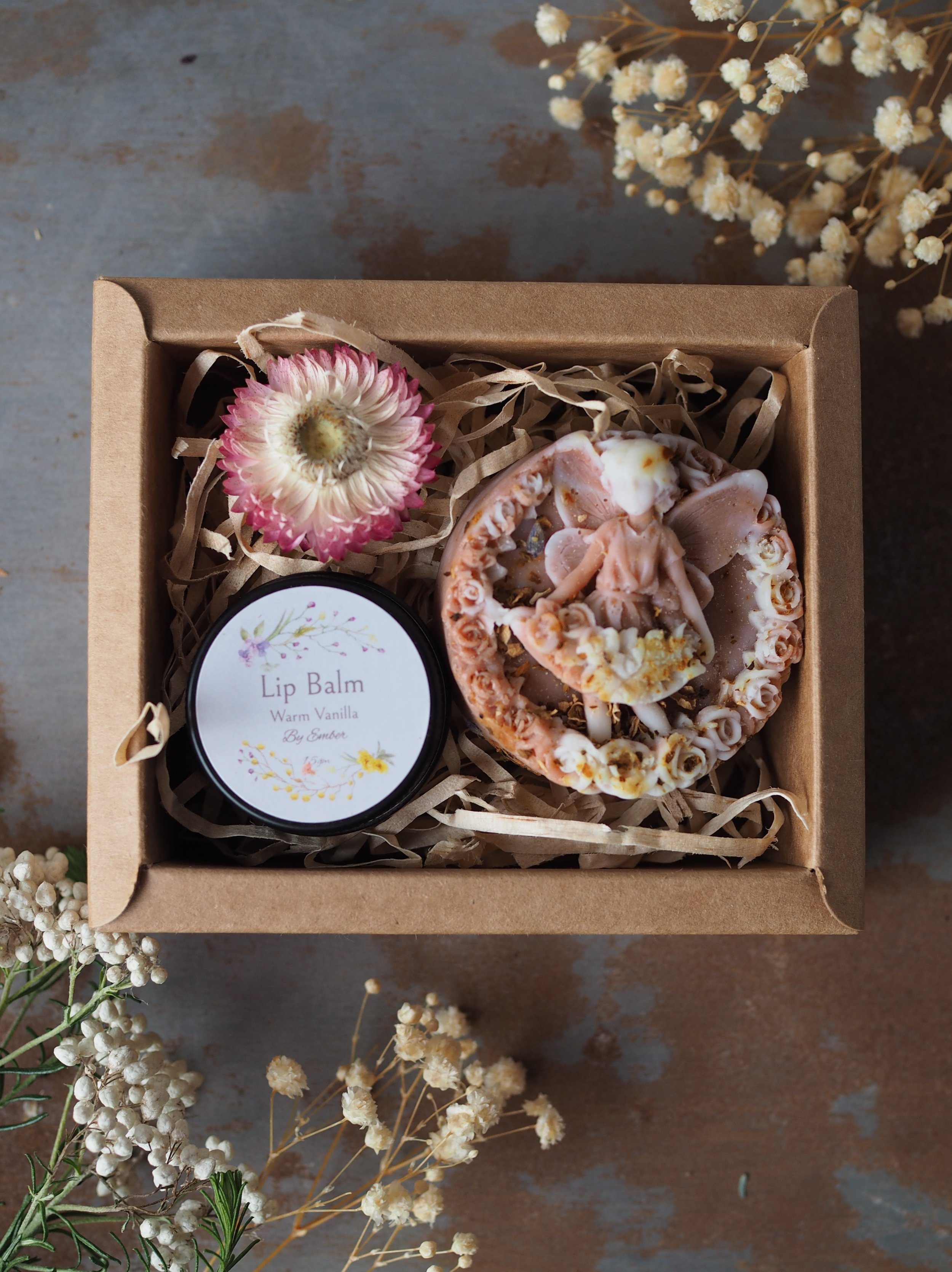 The Fairy Kiss Gift Set A charming duo, beautifully boxed in kraft: • Panna Fairy Soap – whimsical and delicately scented • Ember Lip Balm in Warm Vanilla – rich and nourishing