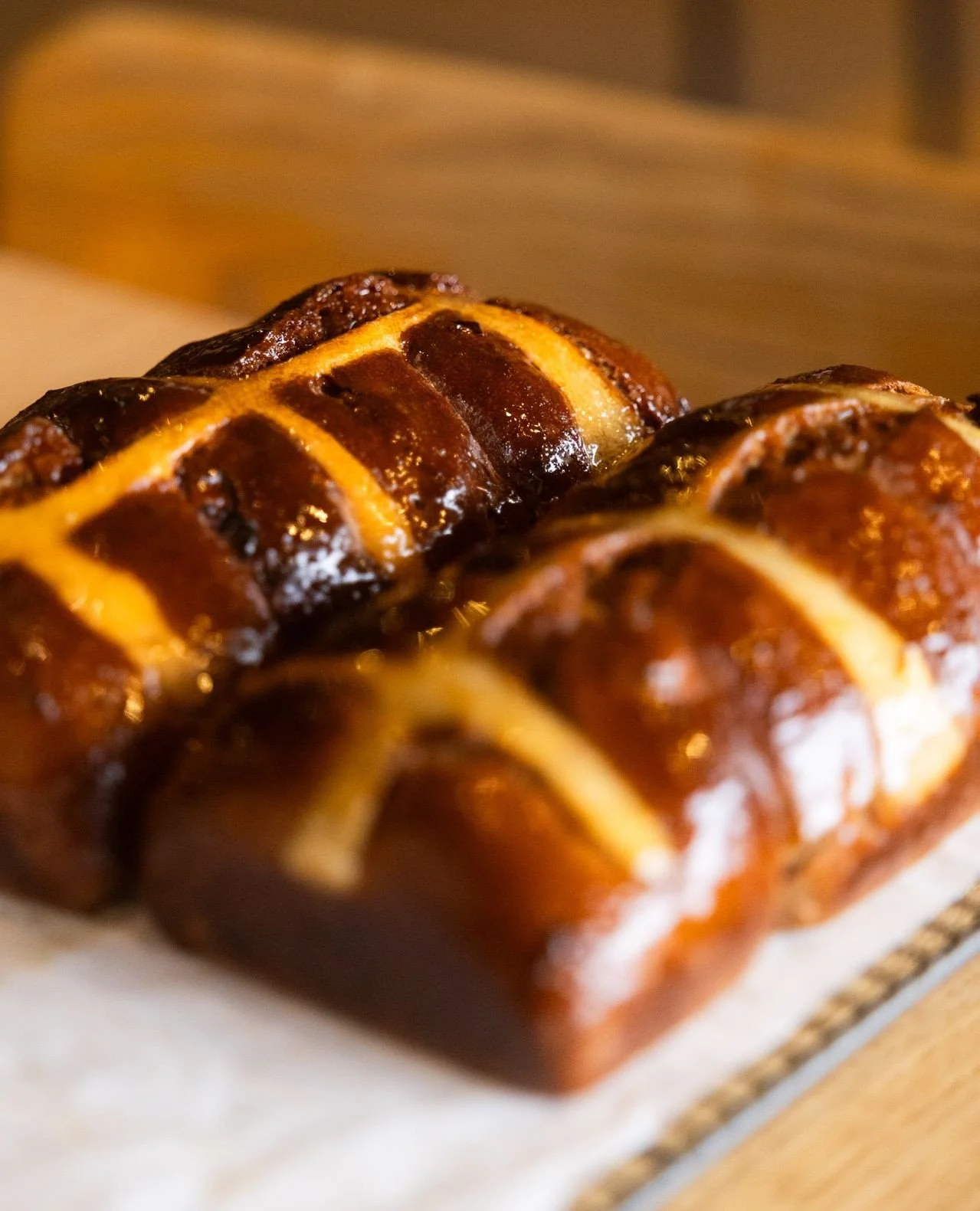 HOT CROSS BUNS ARE HERE 🔥🐇⁠
⁠
Get your hands on a classic hot cross bun spiked with anise myrtle, and finished with a reduced orange juice and hibiscus glaze.⁠
⁠
We&rsquo;re baking them fresh daily, so there&rsquo;s only a limited number each day -