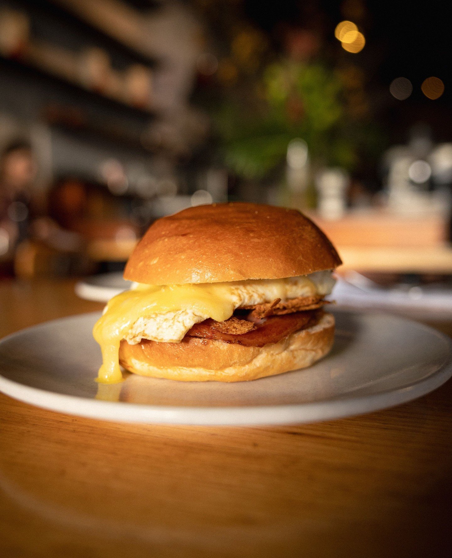 Make your morning a little better with this beauty.⁠
⁠
Hickory bacon, fried egg, red gum smoked tomato relish and Warrnambool cheddar, all tucked into a perfectly toasted milk bun.