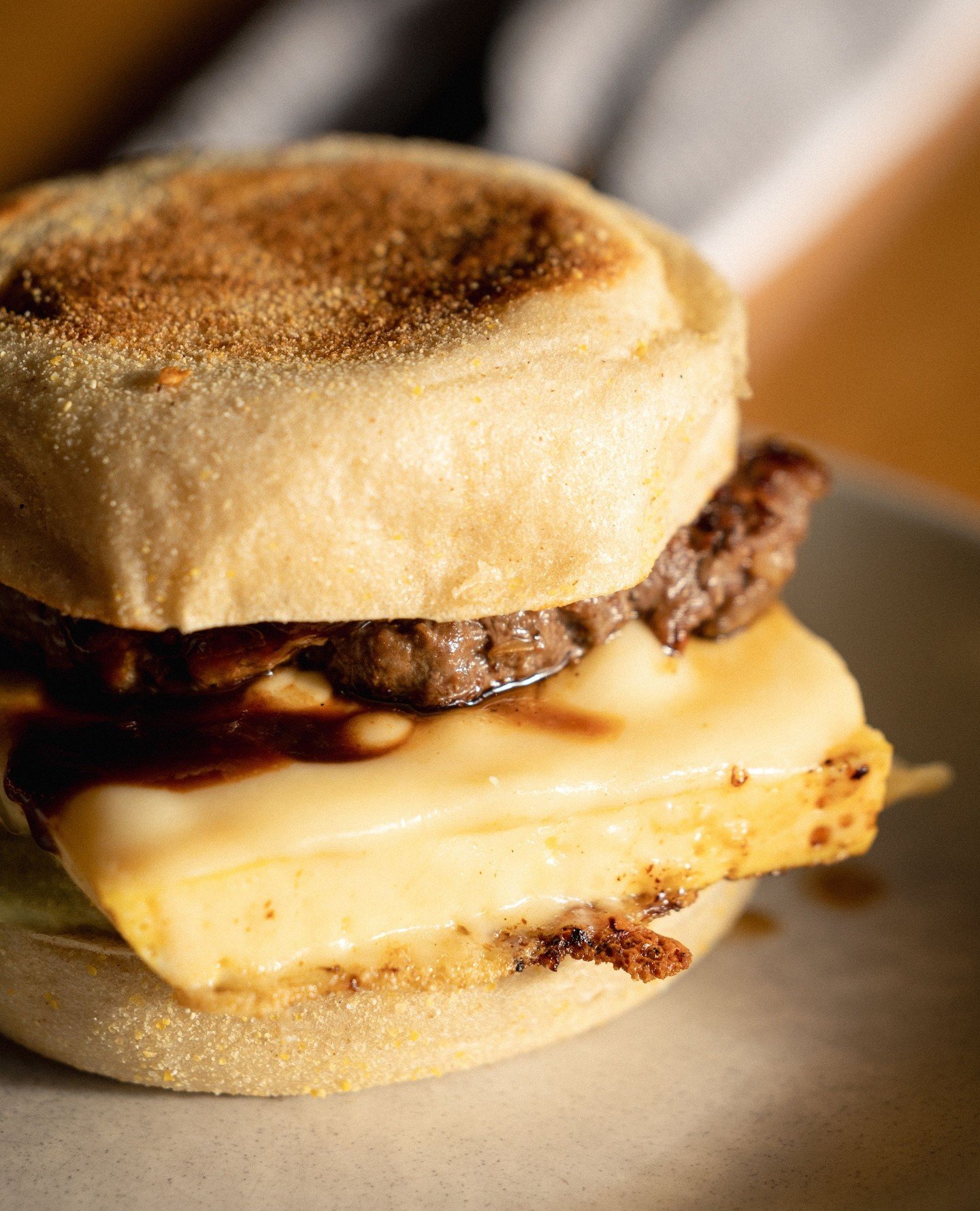 A BTB classic - the Roo Muffin 🦘⁠
⁠
Kangaroo and beef sausage patty, steamed egg, melted Swiss cheese, herb aioli and pepperberry BBQ sauce, all stacked on a toasted sourdough English muffin.⁠
⁠
The best part? $1 from every sale is donated to Purple